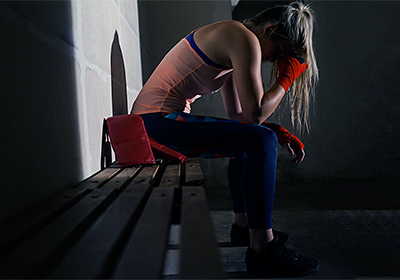Sad woman sitting on bench